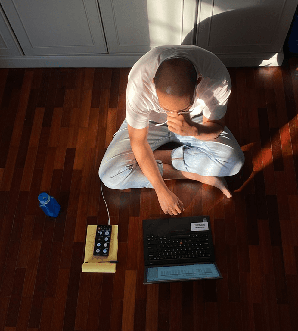 Parent working with laptop and phone